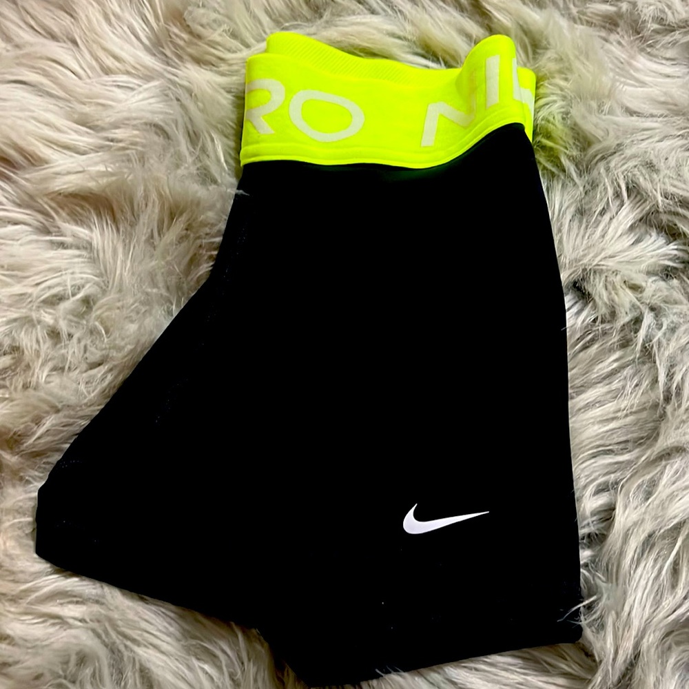 Nike athletic shorts. Black w/ Neon yellow/green logo waistband. NWOT. Size XS